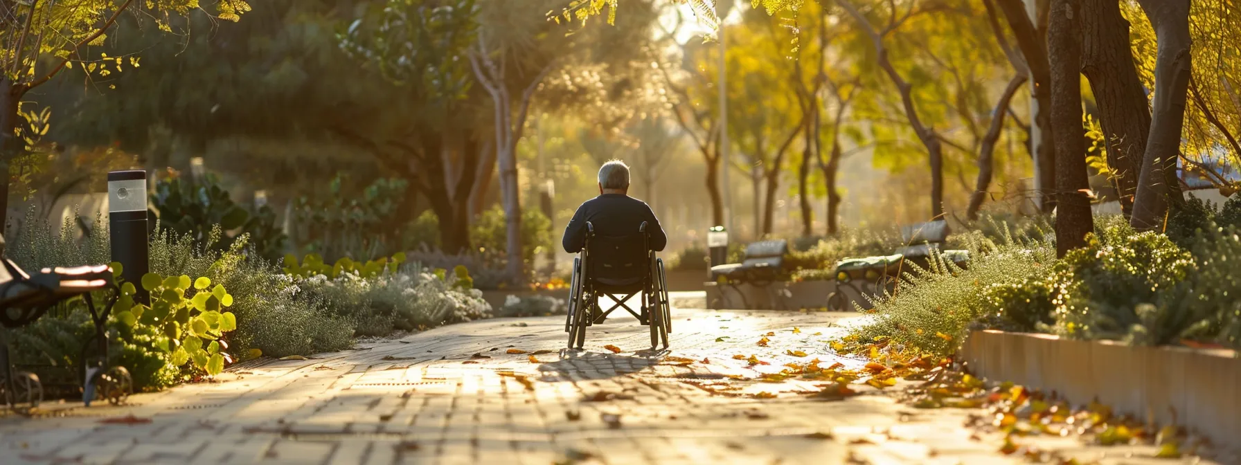 a person in a wheelchair navigating through a wide, unobstructed pathway.