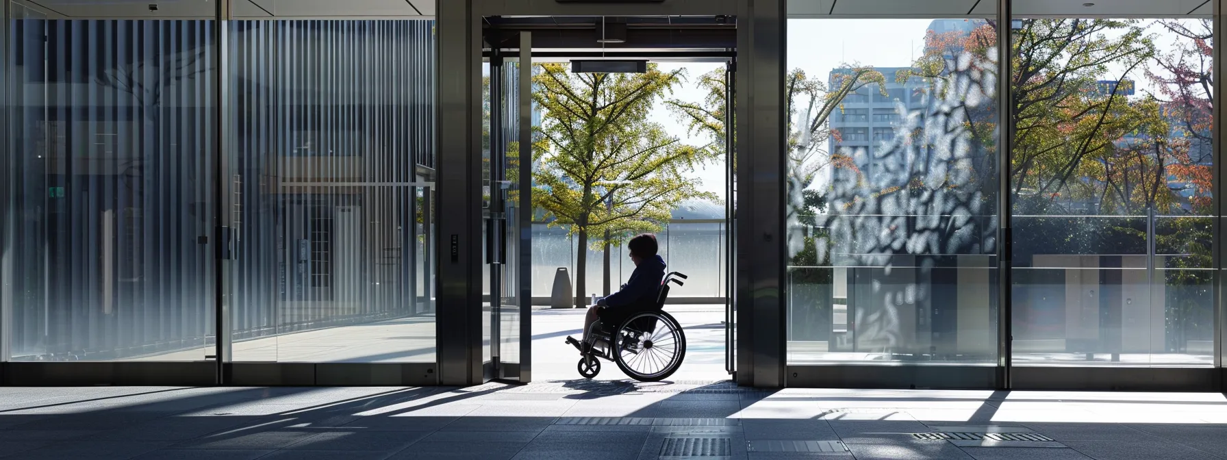 a person in a wheelchair easily passing through a wide door frame with ample space for maneuverability.