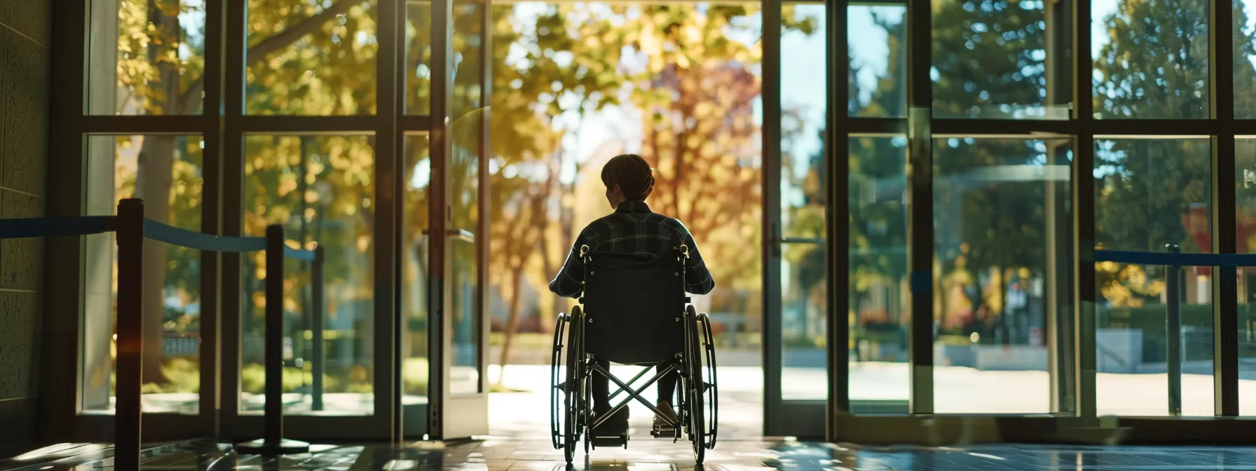 a person in a wheelchair navigating through a door with ample swing clearance for ada compliance.